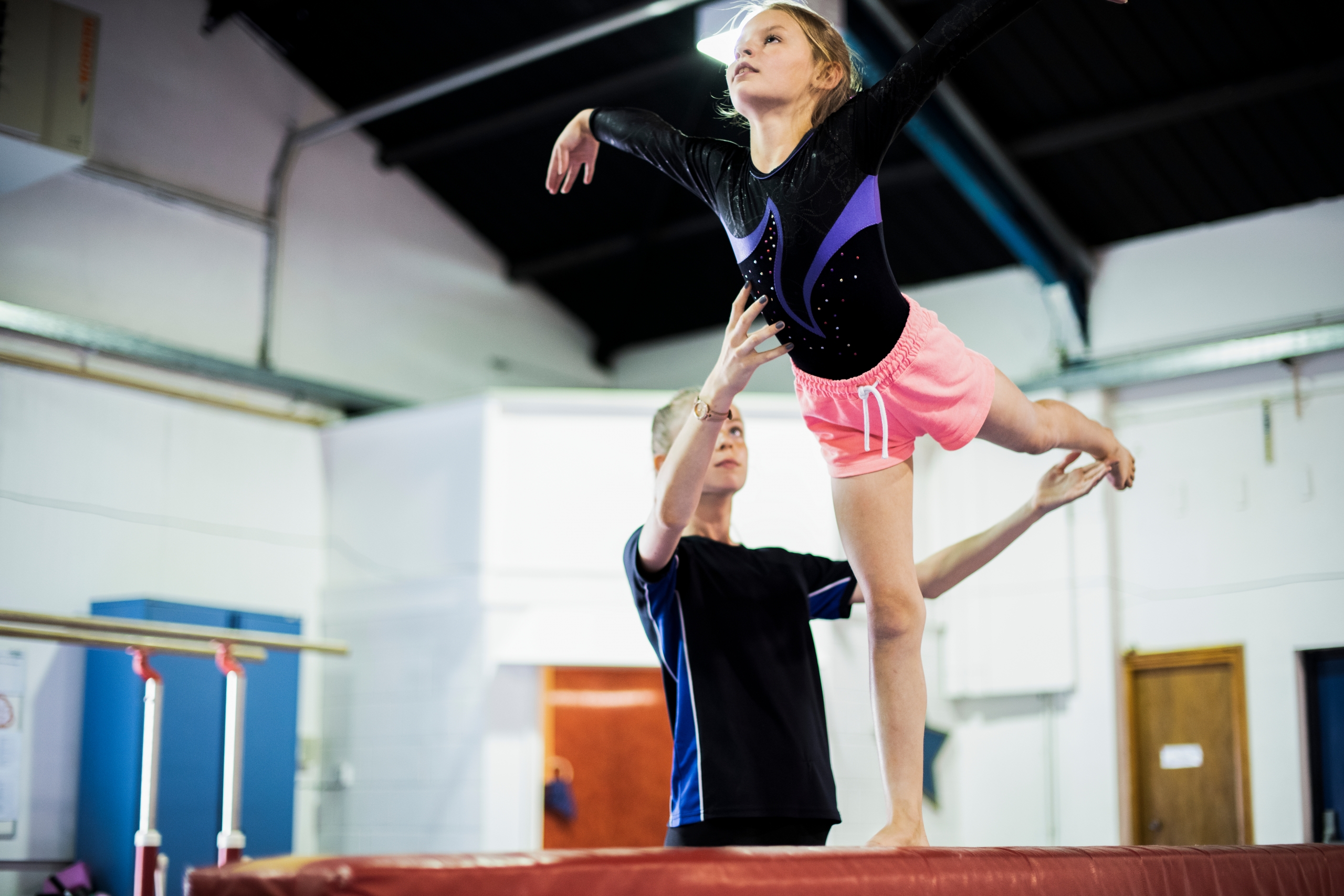 gymnast en trainer