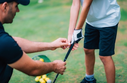 Golf kind en coach